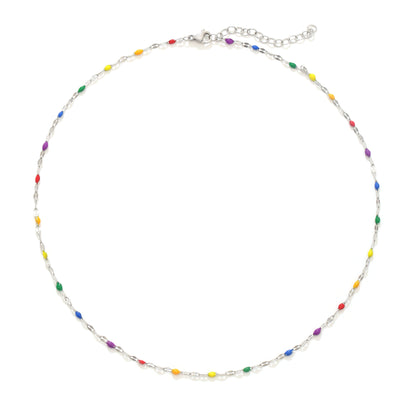 White background with silver pride necklace, pride choker